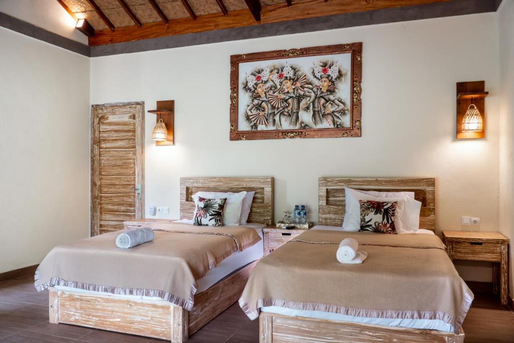 Postel nebo postele na pokoji v ubytování The Asri Villas
