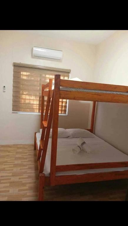 Postel nebo postele na pokoji v ubytování Hideaway Camiguin Homestay