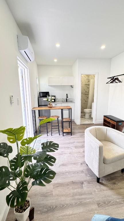 a living room with a couch and a table at Miami North Beach in North Miami Beach