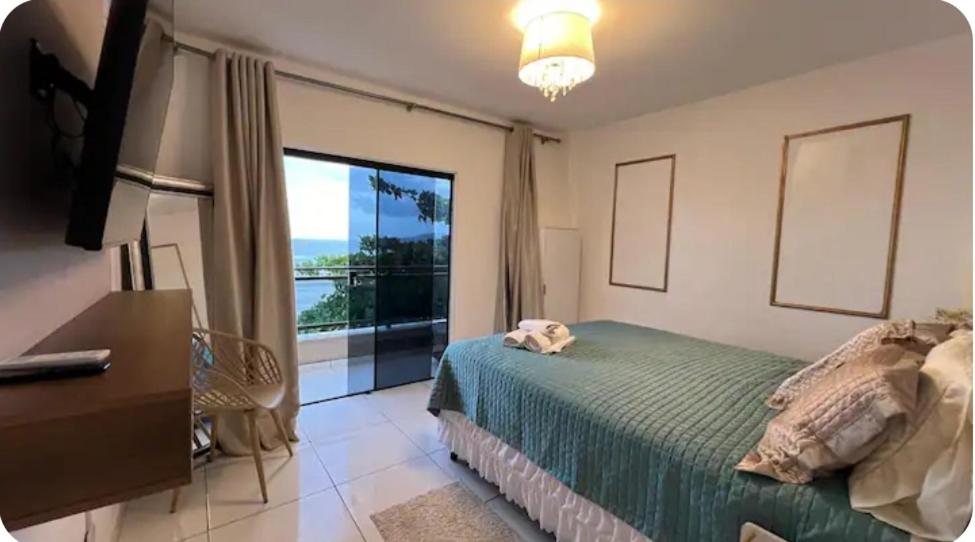 Ένα ή περισσότερα κρεβάτια σε δωμάτιο στο Ap frente mar Meia praia