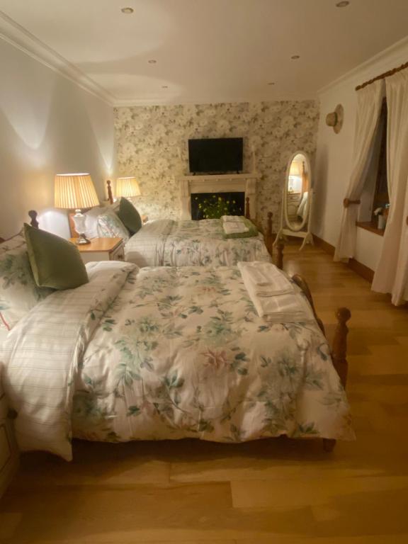 Postel nebo postele na pokoji v ubytování Bayview Guest House