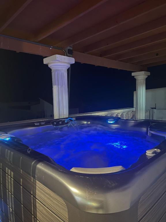 a jacuzzi tub with two columns in a room at Casa mexicana in San Felipe