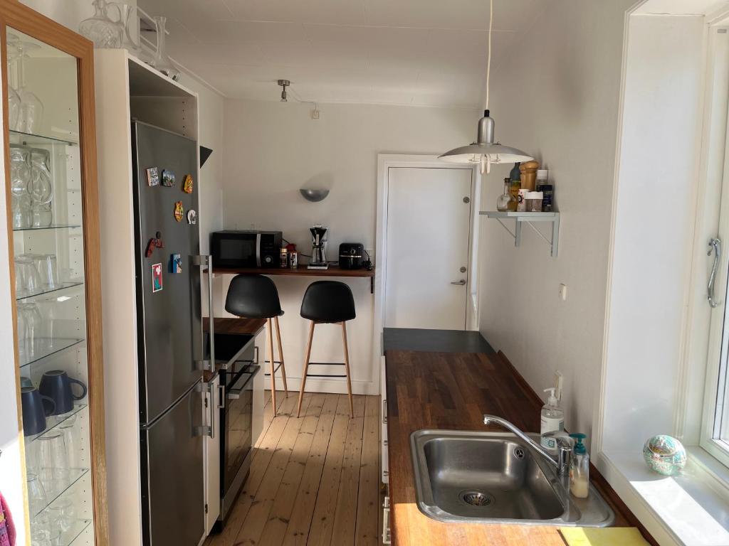 Kuchyň nebo kuchyňský kout v ubytování Cozy and Central