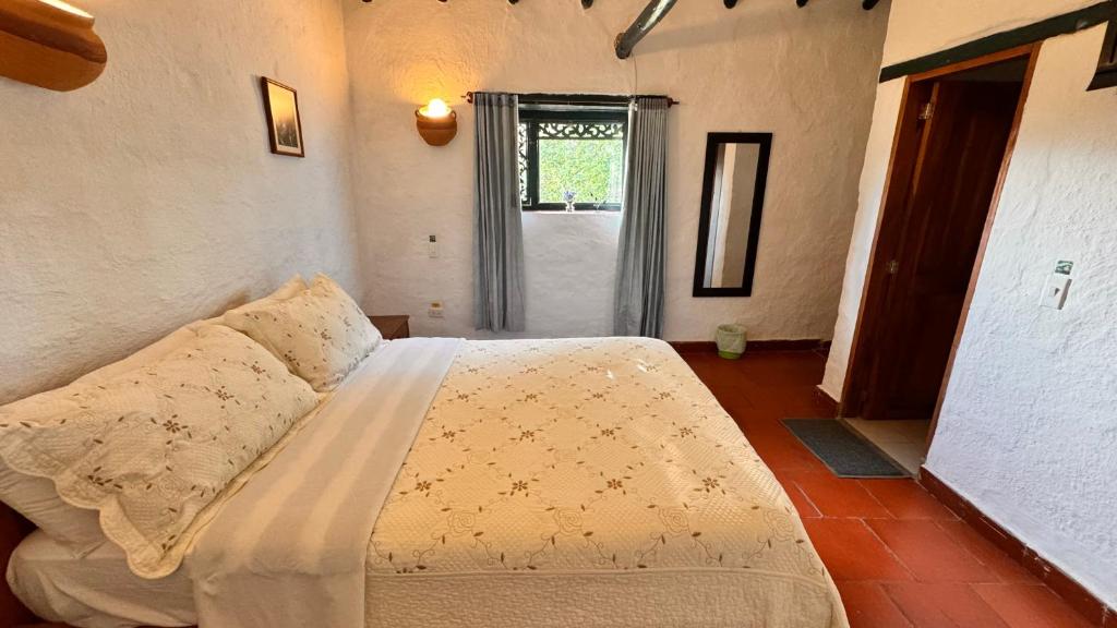Postel nebo postele na pokoji v ubytování Posada Campestre La Casona