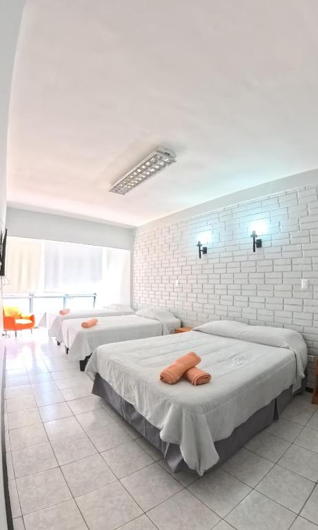 Postel nebo postele na pokoji v ubytování Hotel Qamiri
