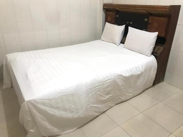 Postel nebo postele na pokoji v ubytování OYO 93864 Wisma Gading Syariah