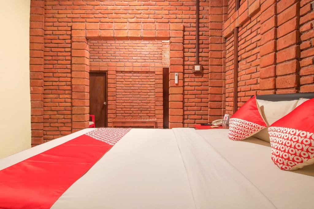 Postel nebo postele na pokoji v ubytování Super OYO 3118 Maxi Budget