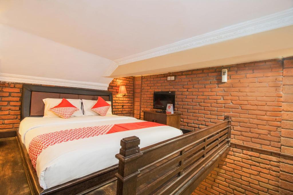 Postel nebo postele na pokoji v ubytování Super OYO 3118 Maxi Budget