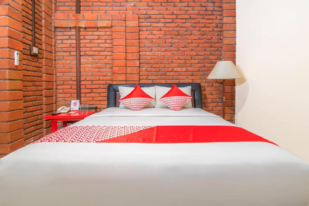 Postel nebo postele na pokoji v ubytování Super OYO 3118 Maxi Budget