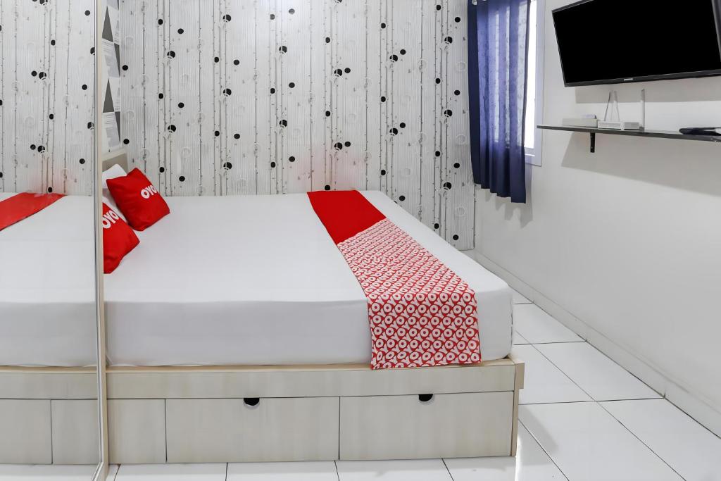 Postel nebo postele na pokoji v ubytování OYO 93701 Room Transit By At