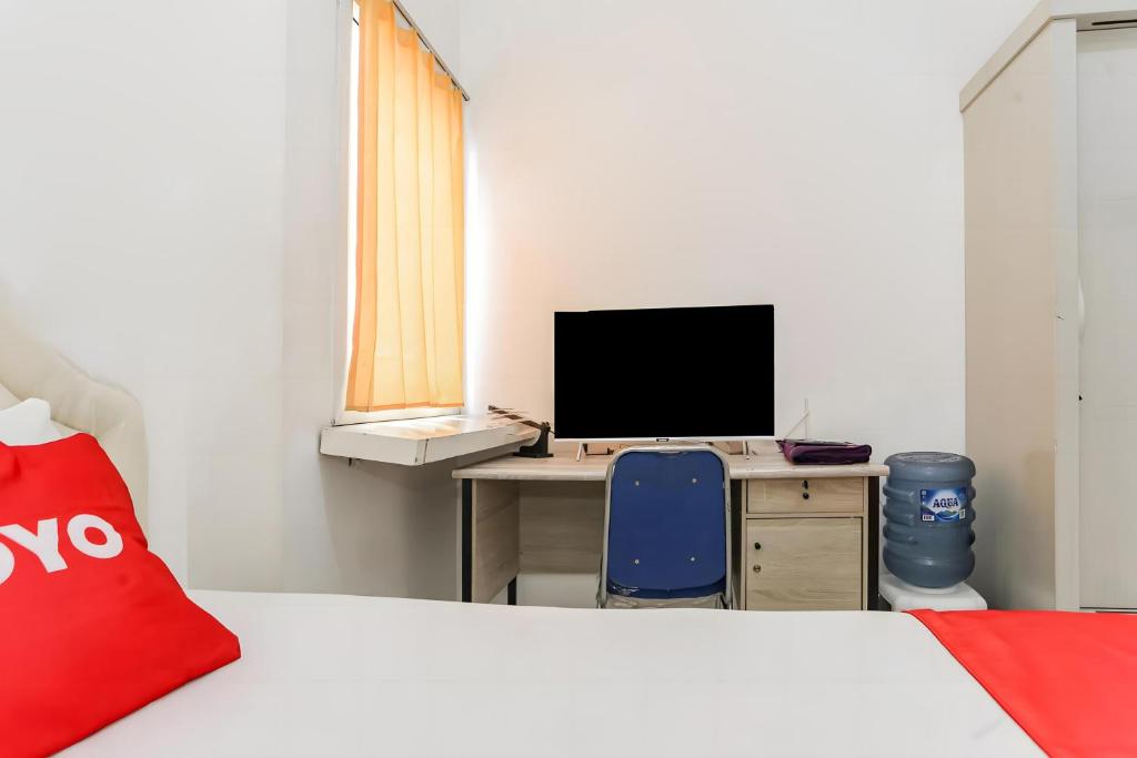 TV a/nebo společenská místnost v ubytování OYO 93701 Room Transit By At