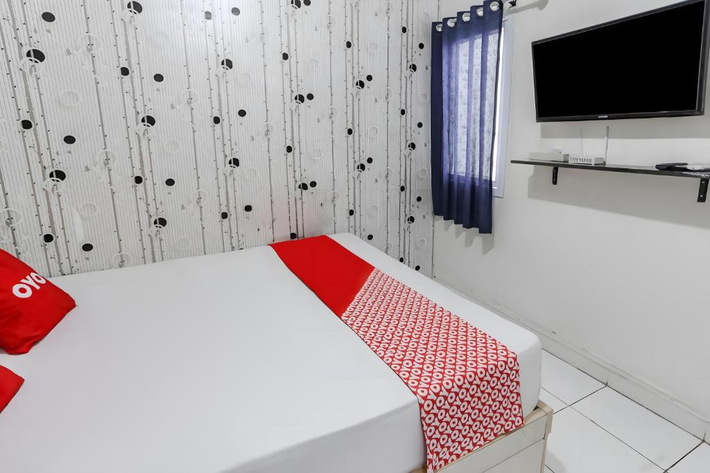 TV a/nebo společenská místnost v ubytování OYO 93701 Room Transit By At