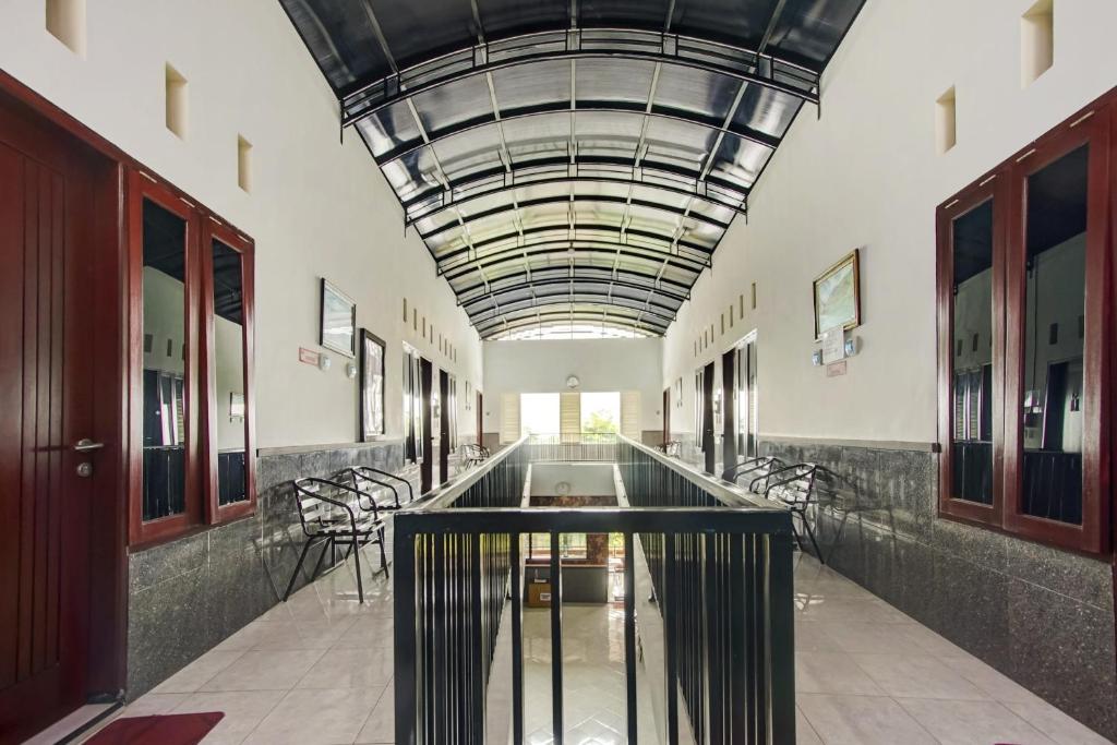 Fotografie z fotogalerie ubytování Super OYO Capital O 90151 Guest House 180 v destinaci Batu