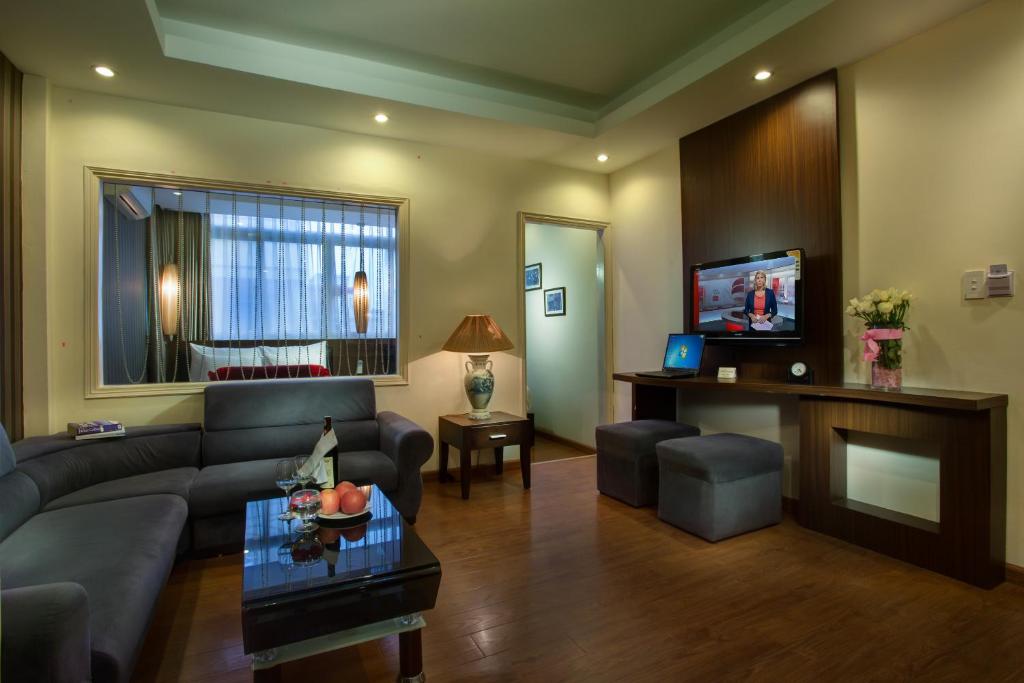 TV a/nebo společenská místnost v ubytování Golden Art Hotel