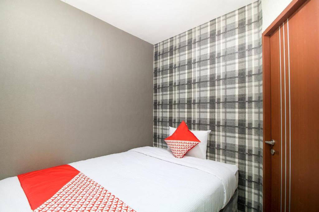 Postel nebo postele na pokoji v ubytování Super OYO Capital O 217 A1 Hotel