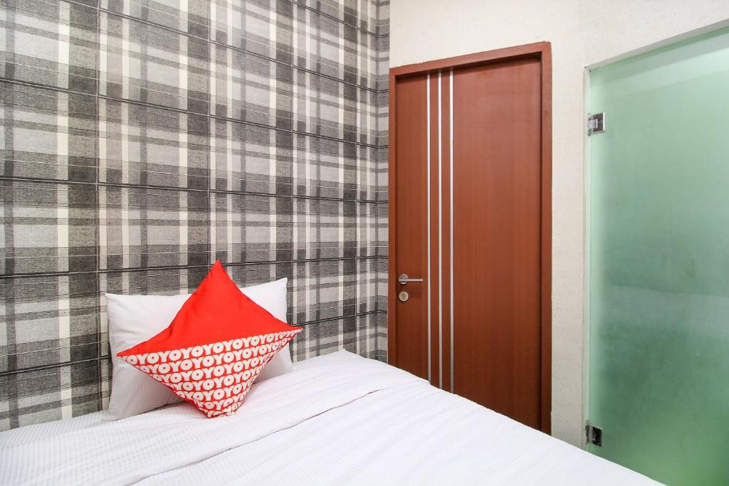 Postel nebo postele na pokoji v ubytování Super OYO Capital O 217 A1 Hotel