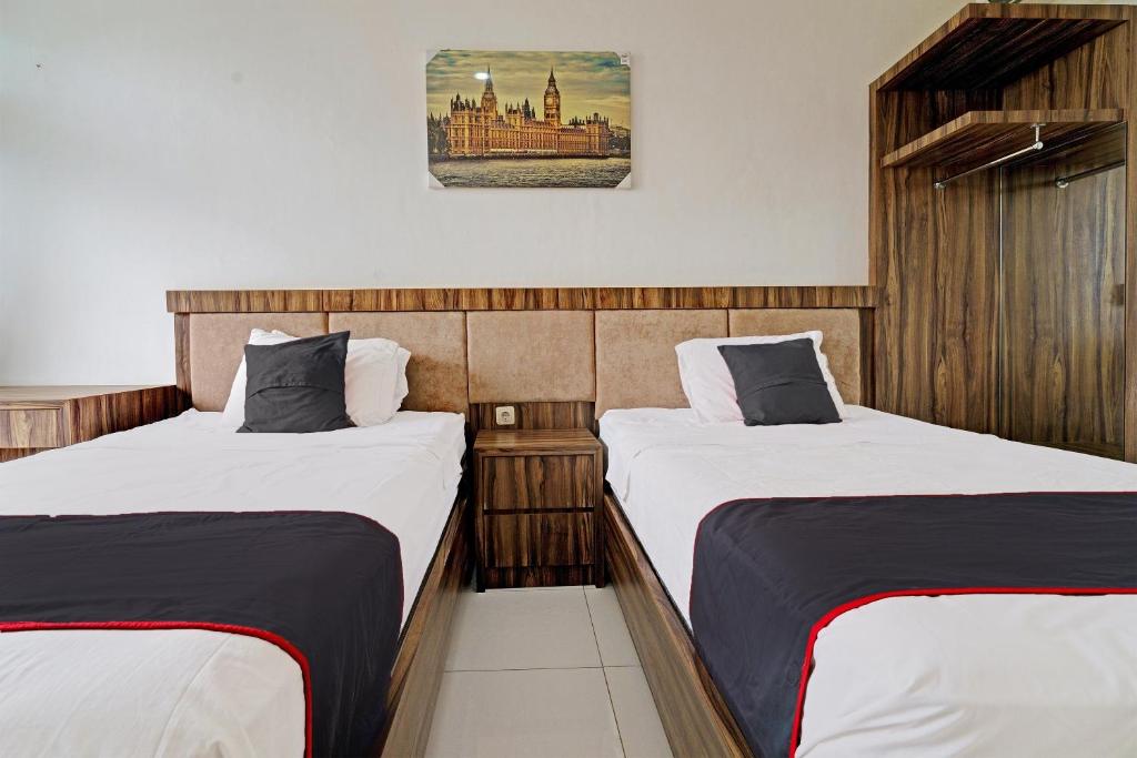 Postel nebo postele na pokoji v ubytování SUPER OYO Collection O 92277 Setra Priangan Guest House
