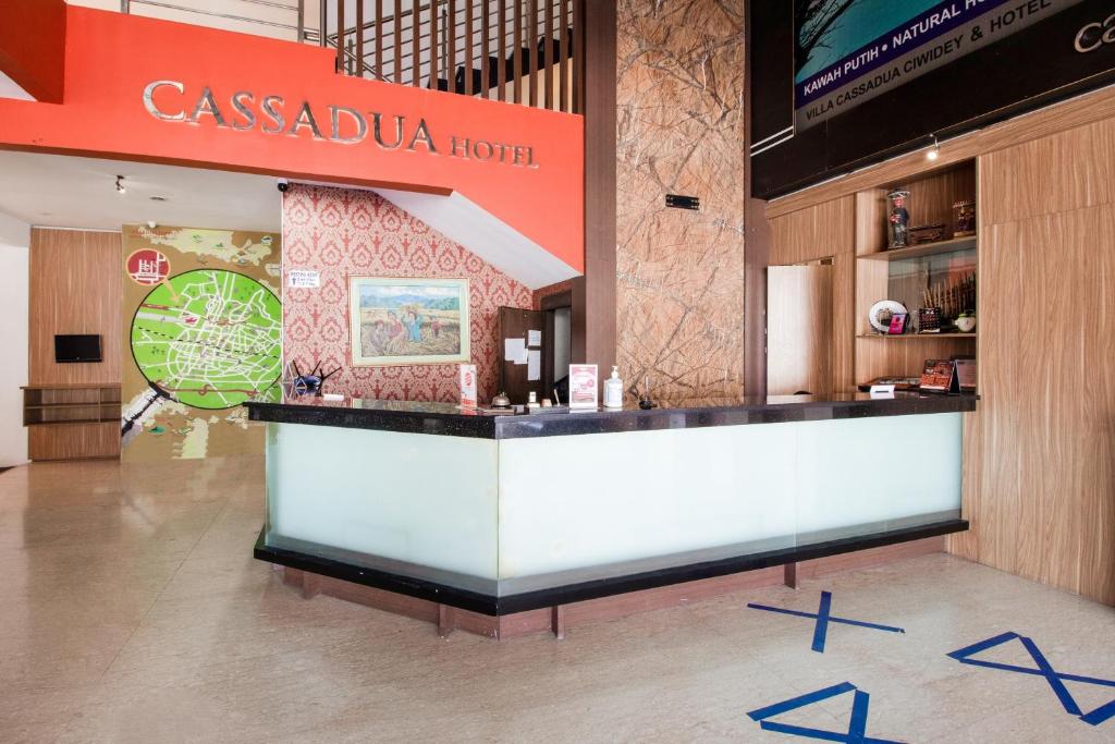 a restaurant with a counter in a building at Collection O near Paris Van Java formerly Cassa Dua Hotel in Bandung
