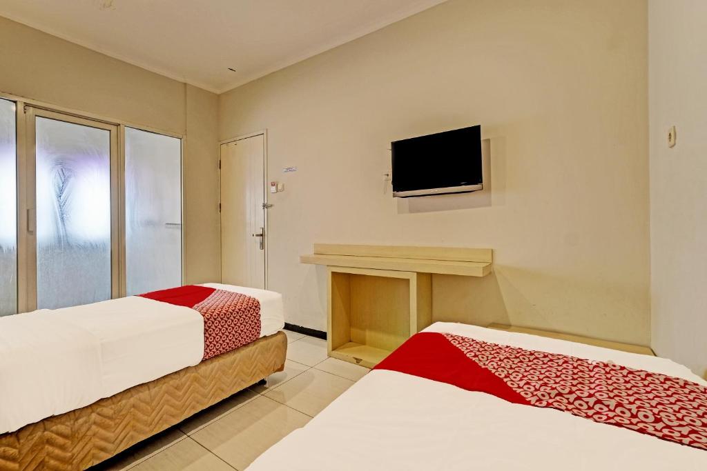 Postel nebo postele na pokoji v ubytování Sky Guesthouse