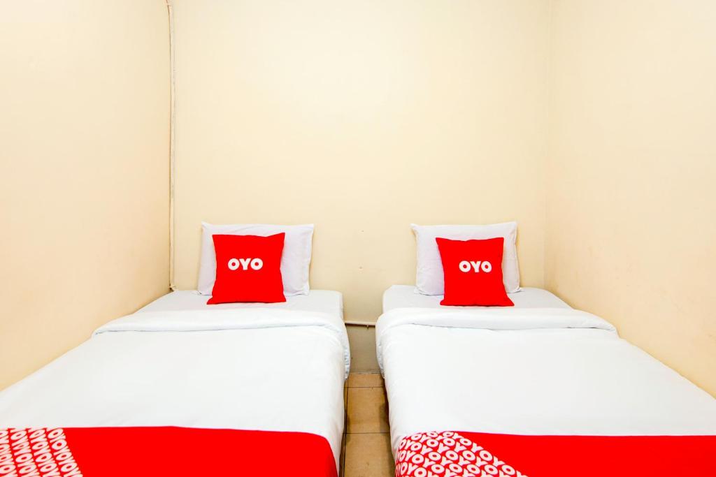 Postel nebo postele na pokoji v ubytování OYO 2045 Hotel 211