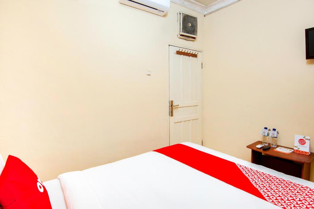 Postel nebo postele na pokoji v ubytování OYO 2045 Hotel 211