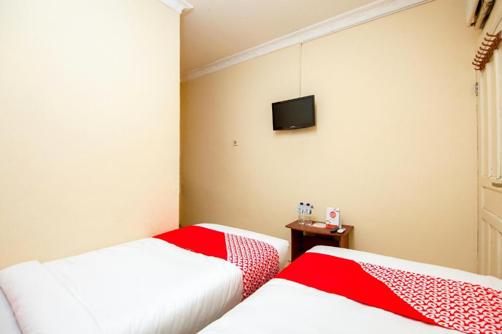 Postel nebo postele na pokoji v ubytování OYO 2045 Hotel 211