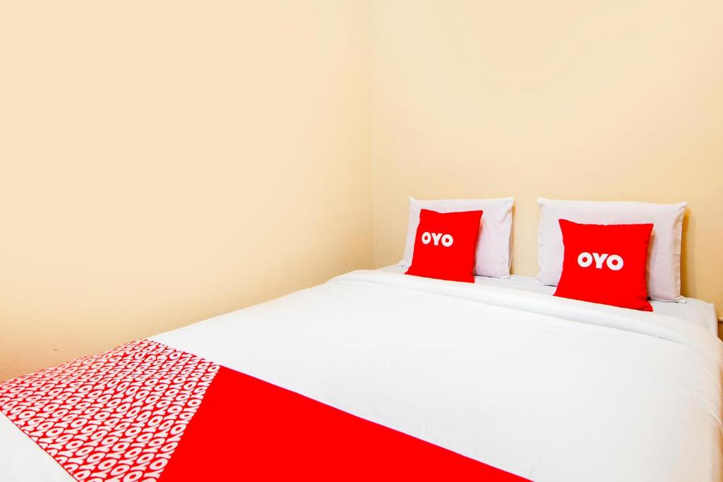Postel nebo postele na pokoji v ubytování OYO 2045 Hotel 211