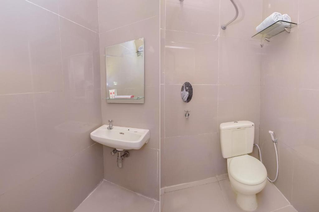 Koupelna v ubytování Capital O 854 Ub Caisar Hotel