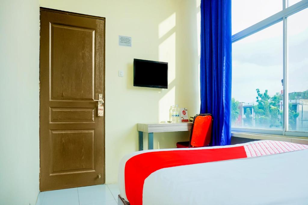 Postel nebo postele na pokoji v ubytování OYO 1192 Lotus Inn