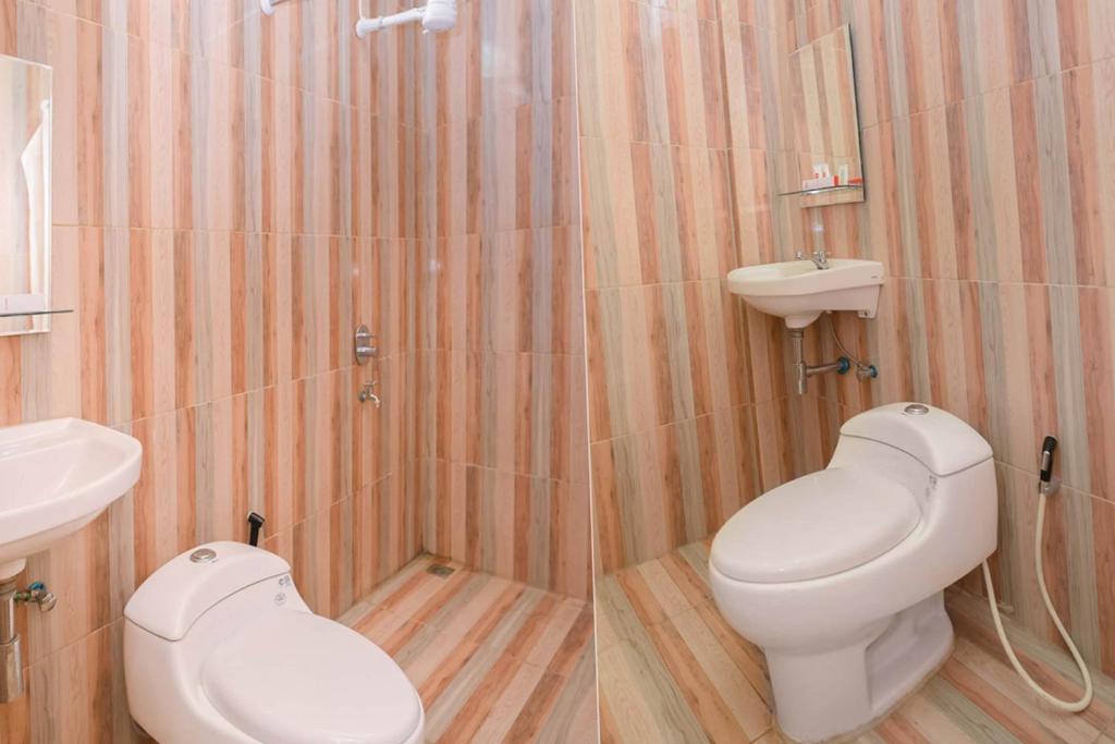 Koupelna v ubytování Capital O 854 Ub Caisar Hotel