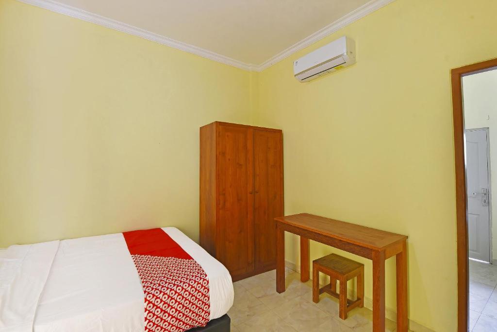Postel nebo postele na pokoji v ubytování OYO Life 90675 Ld Residence