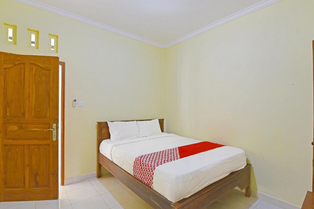 Postel nebo postele na pokoji v ubytování OYO Life 90675 Ld Residence