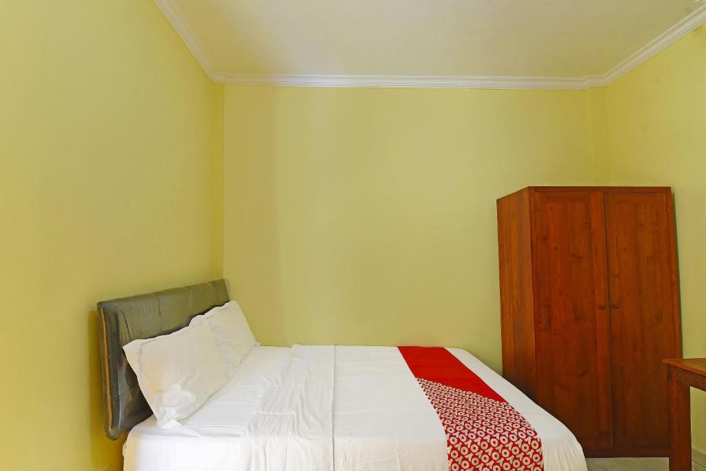 Postel nebo postele na pokoji v ubytování OYO Life 90675 Ld Residence