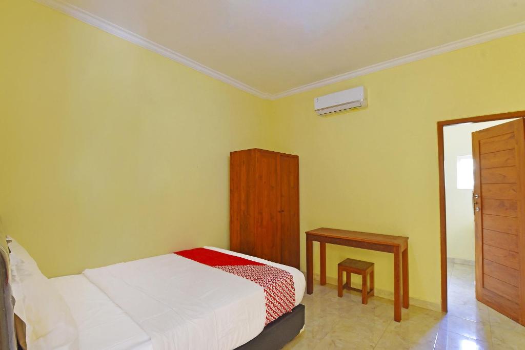 Postel nebo postele na pokoji v ubytování OYO Life 90675 Ld Residence