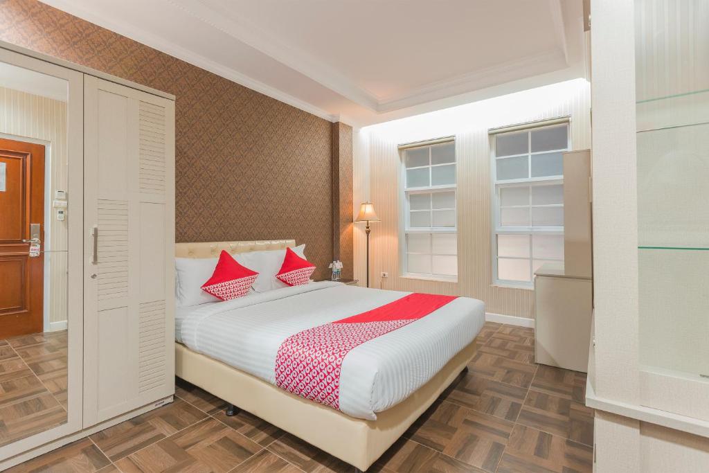 Postel nebo postele na pokoji v ubytování Super OYO Capital O 371 Kwitang Guest House