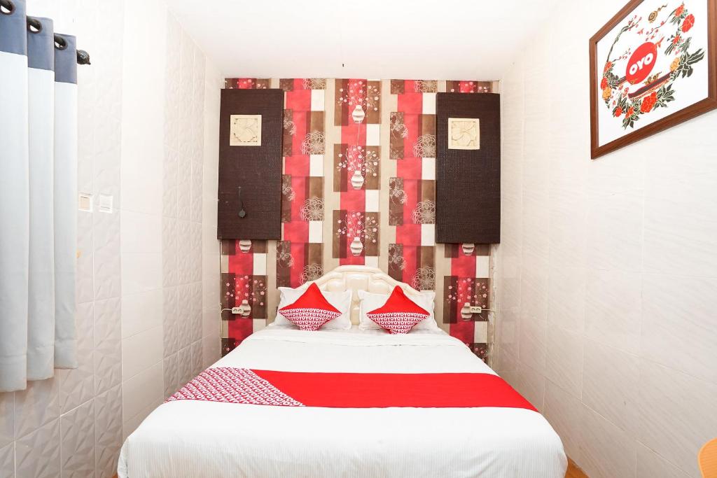 Postel nebo postele na pokoji v ubytování OYO 425 Mojokerto Guesthouse