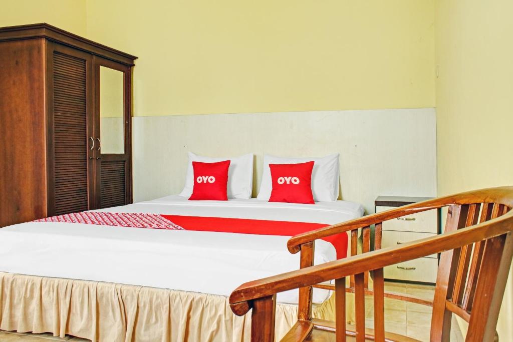 Postel nebo postele na pokoji v ubytování OYO 90423 Hotel Aman