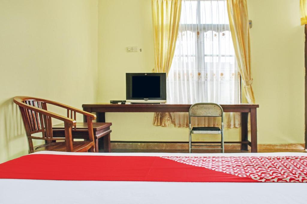 TV a/nebo společenská místnost v ubytování OYO 90423 Hotel Aman