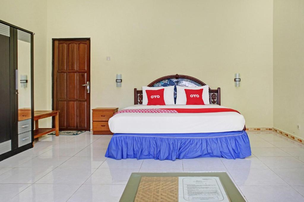 Postel nebo postele na pokoji v ubytování OYO 90423 Hotel Aman