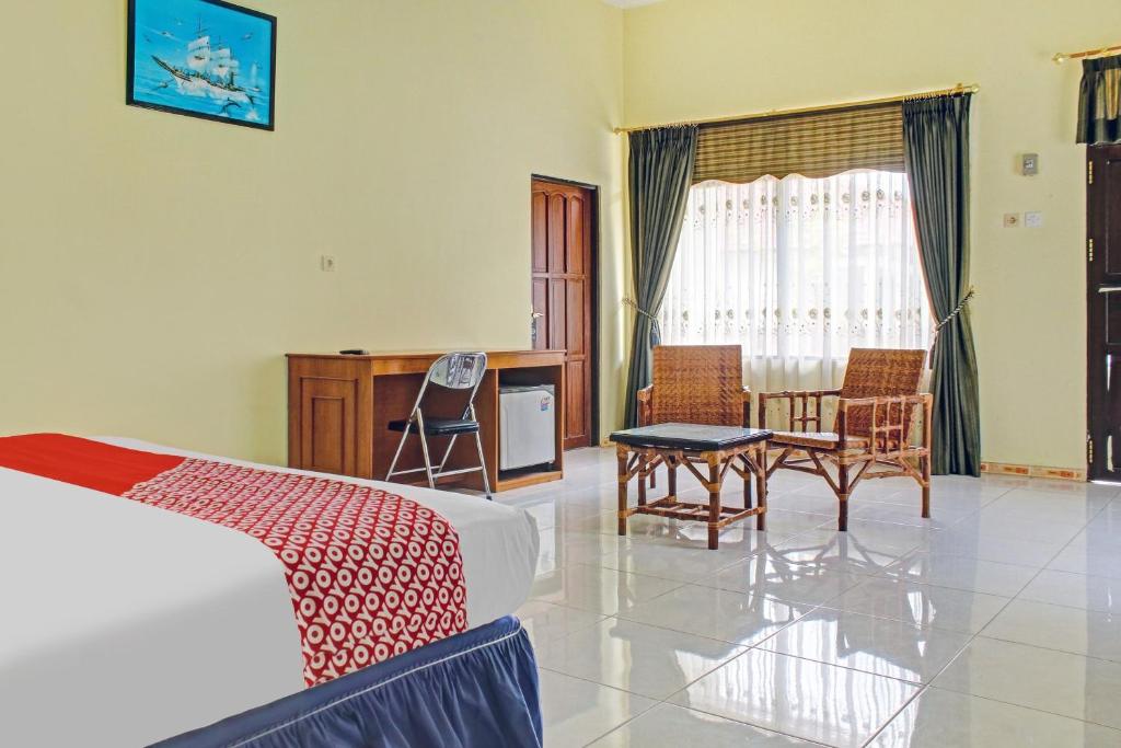 Postel nebo postele na pokoji v ubytování OYO 90423 Hotel Aman