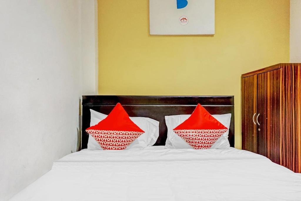 Rúm í herbergi á Super OYO 90692 Point Hostel