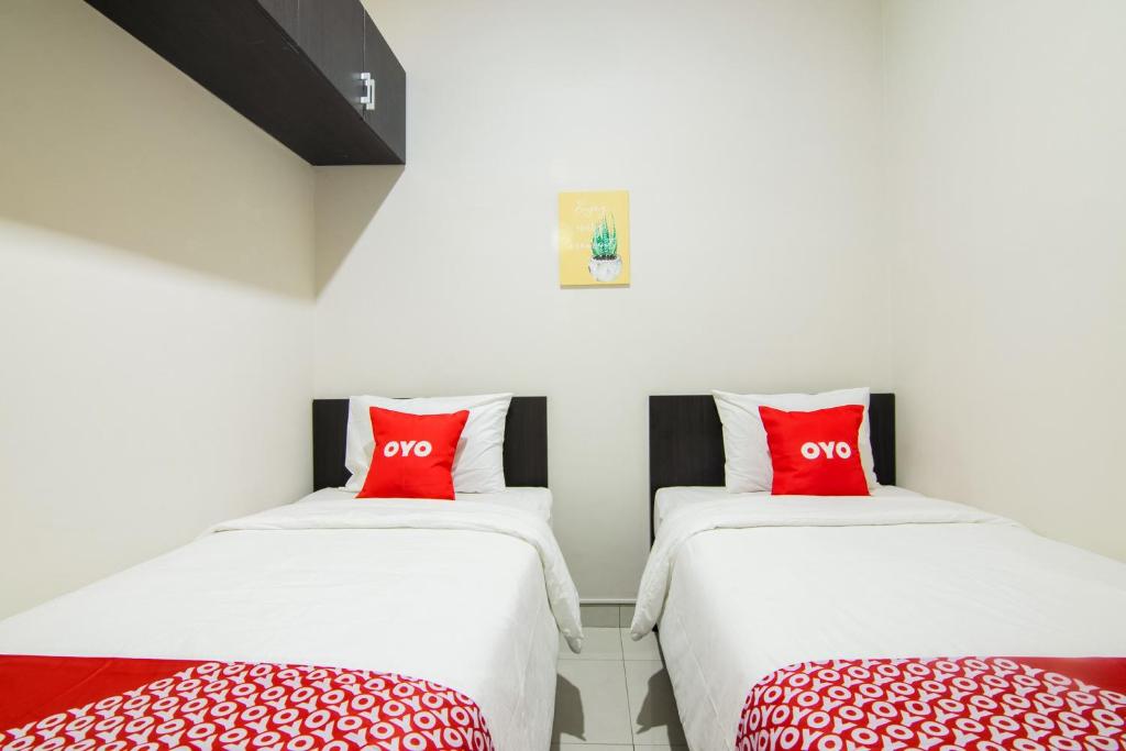 Postel nebo postele na pokoji v ubytování OYO 3826 Columbus Residence K11