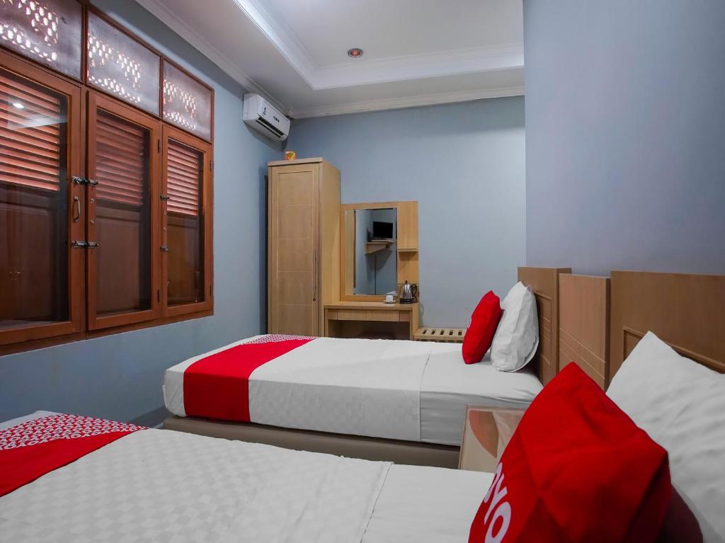 Postel nebo postele na pokoji v ubytování Collection O 89999 Hotel Bumi Kedaton Resort