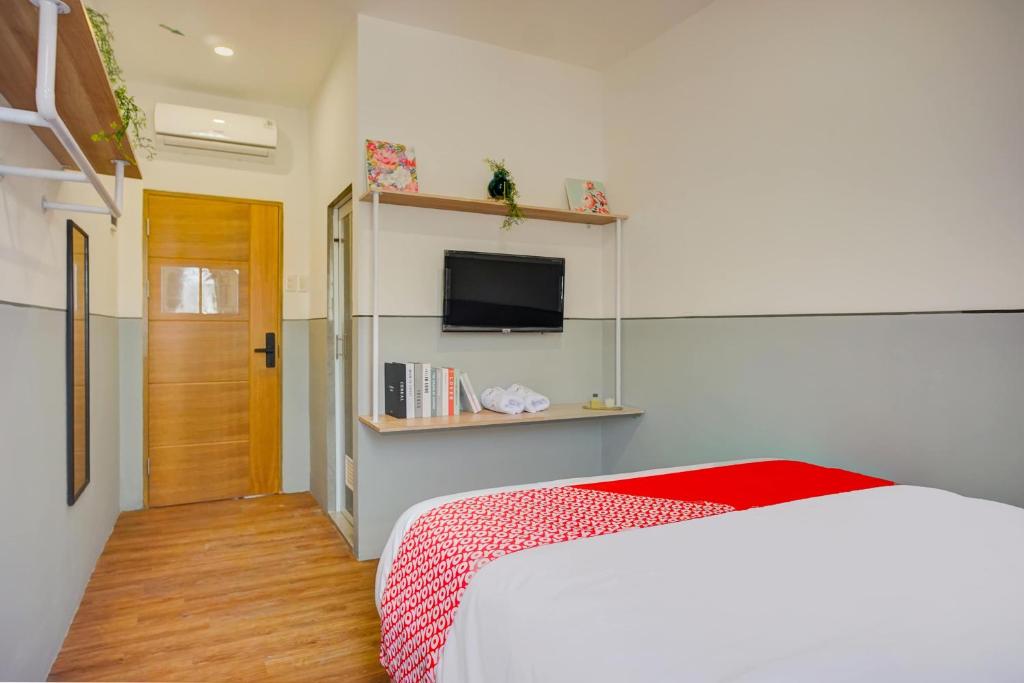 Postel nebo postele na pokoji v ubytování SUPER OYO 93064 Alhesa Residence