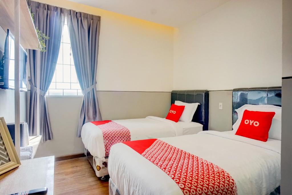 Postel nebo postele na pokoji v ubytování SUPER OYO 93064 Alhesa Residence