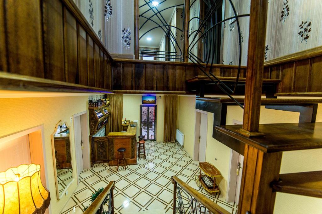 an overhead view of a large room with a staircase at HOTEL GUGLUX &WINE CELLAR in Tʼelavi