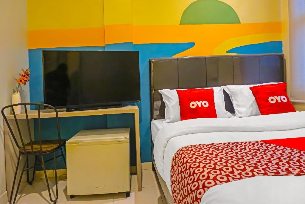 Postel nebo postele na pokoji v ubytování Super OYO 92271 Orienchi 3