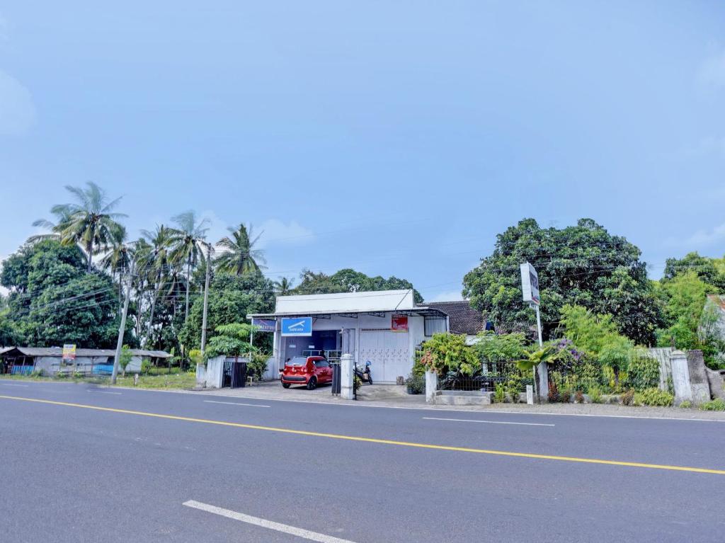 a gas station on the side of a road at OYO Life 92937 Kost Putri Sarkara Syariah in Banyuwangi