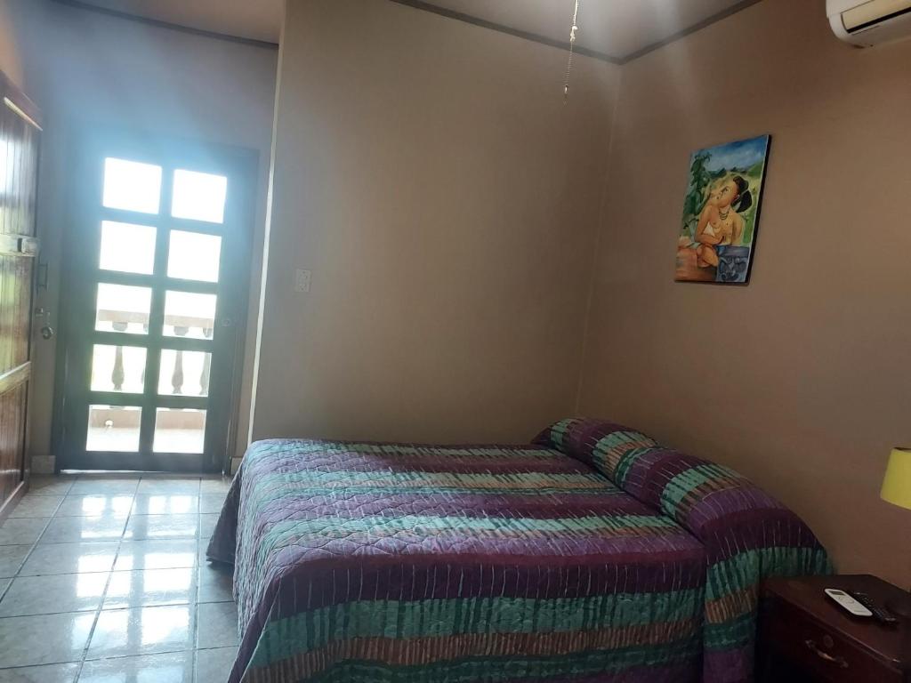 Postel nebo postele na pokoji v ubytování Hotel La Escalinata
