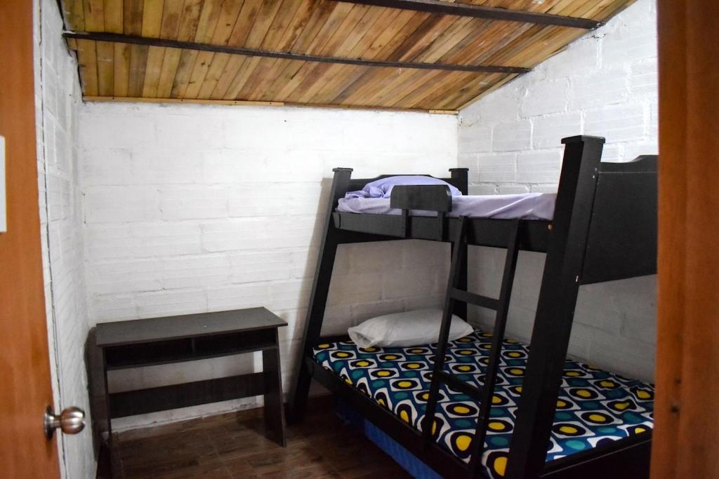 Postel nebo postele na pokoji v ubytování Hostal otro cuento